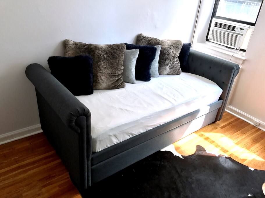 Trundle daybed. Accommodates two people when pulled out.