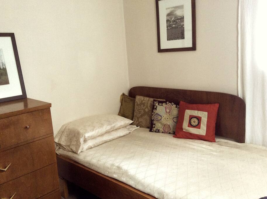 Wide single bed in third bedroom.