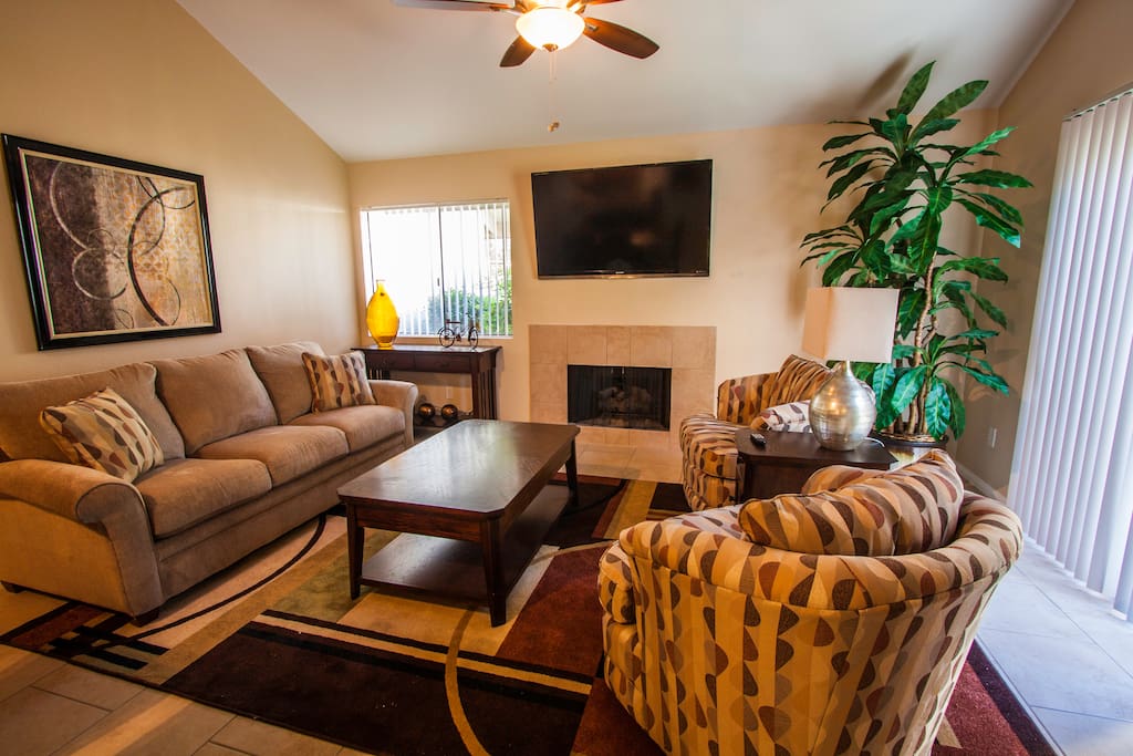 Living Room is well designed, relaxing... BBQ right outside sliding door! Flat Screen TV, too!