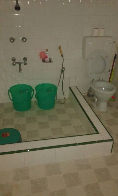 Fully accommodating bathing cum toilet area