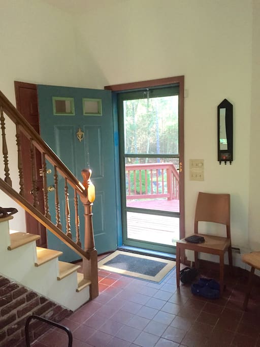 Front door and stairs leading to your bedroom, bathroom and upstairs living area