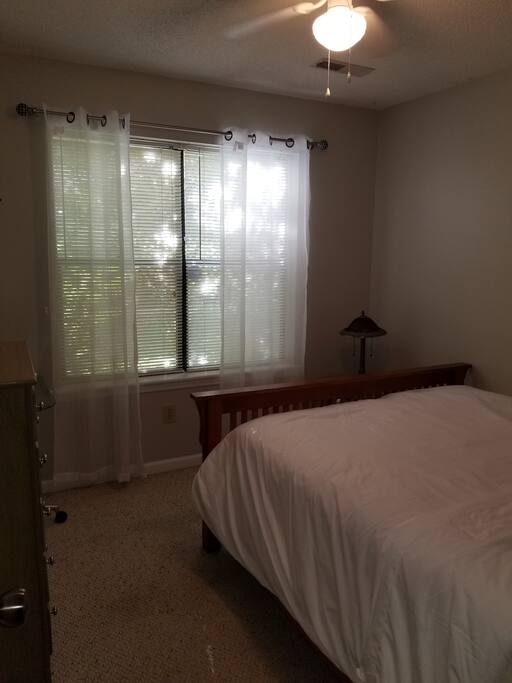comfortable & soft queen bedroom with closet, dresser and ceiling fan