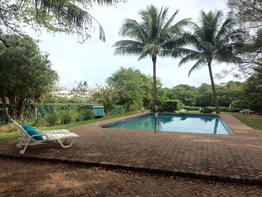 Relax on a lounge while enjoying a poolside cocktail