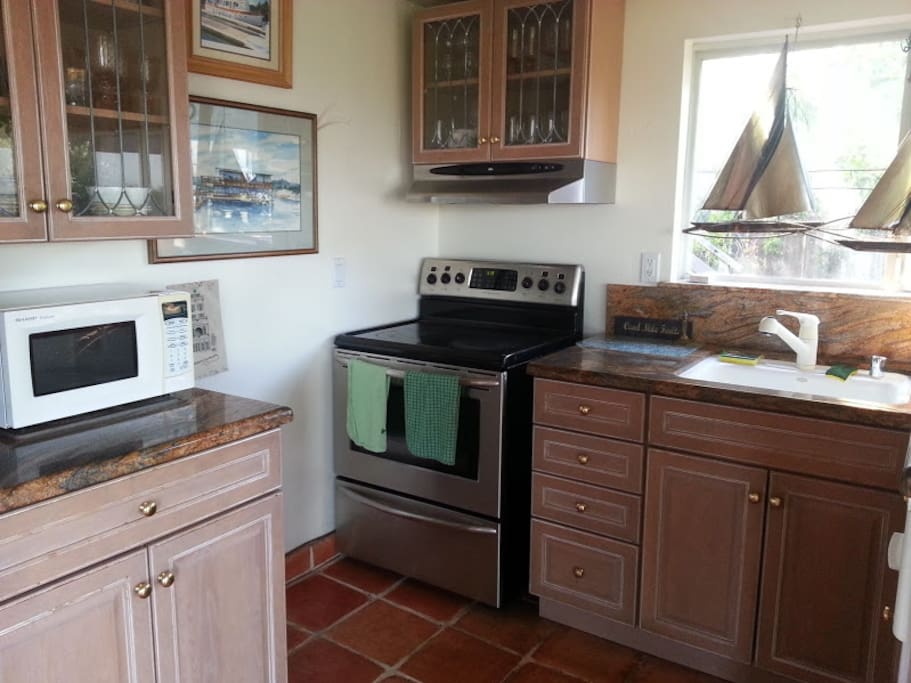 Full Kitchen with all plates, cups, silverware, pots, pans