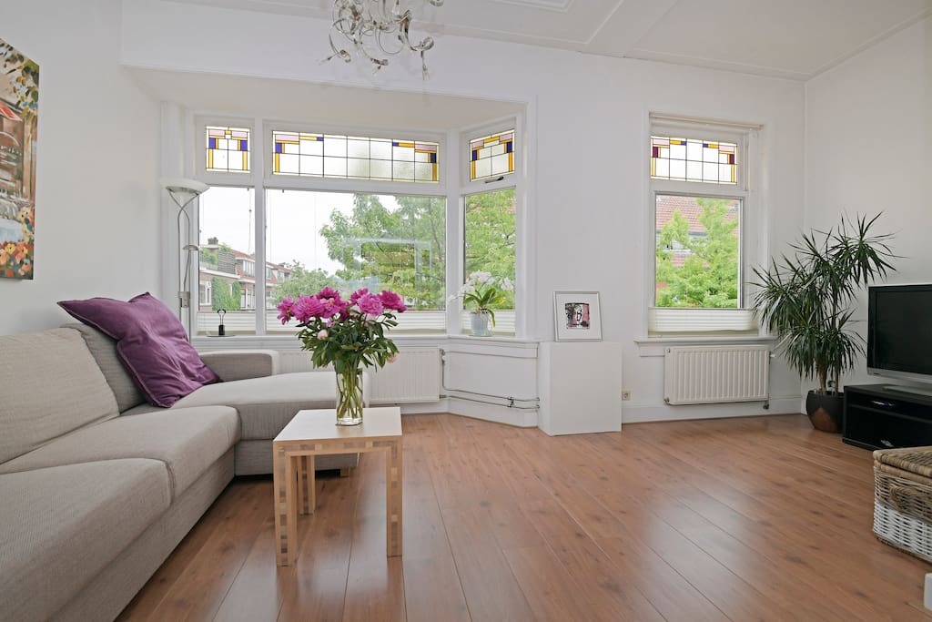 Front living room with stain-glass adorned windows and 180 degree view