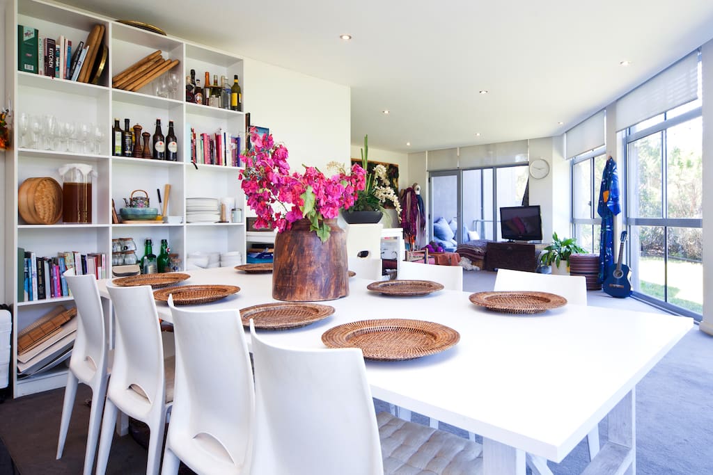 8 seater dining table with view through to the TV and lounge area.