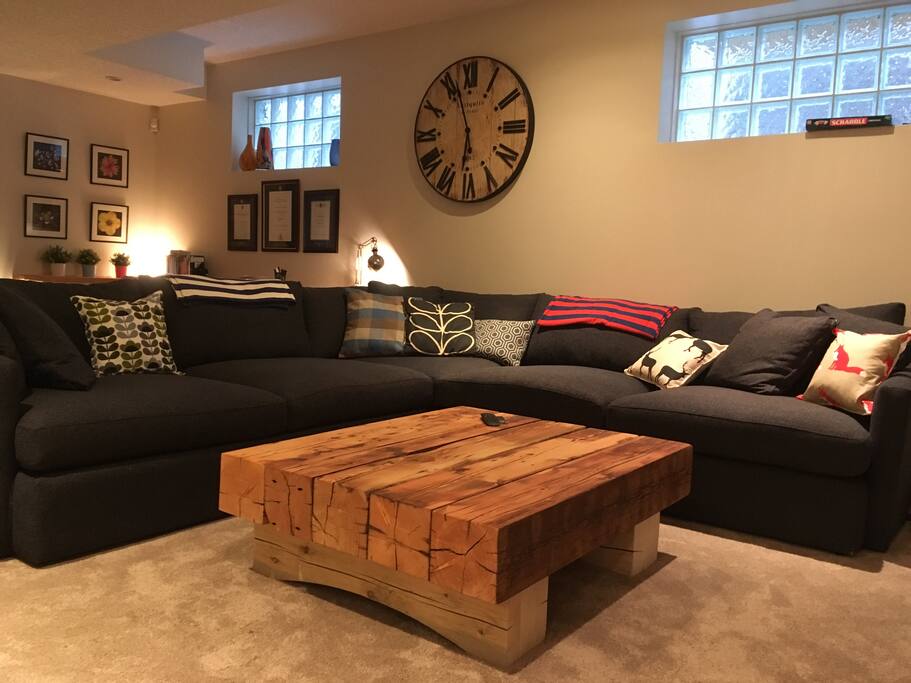 Basement TV room with huge sofa and 4K TV, cable, Kodi and Netflix