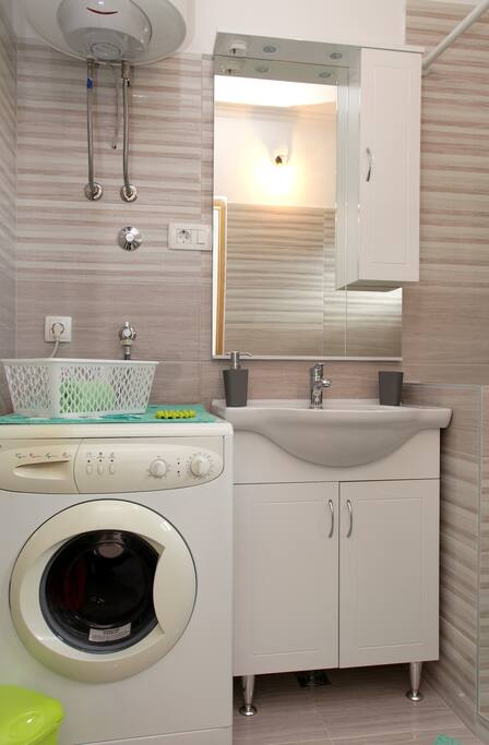 Toilet with sink and washing machine
