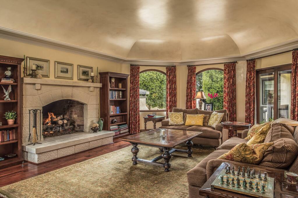 Gorgeously detailed living room with gas fireplace and seating for 5.