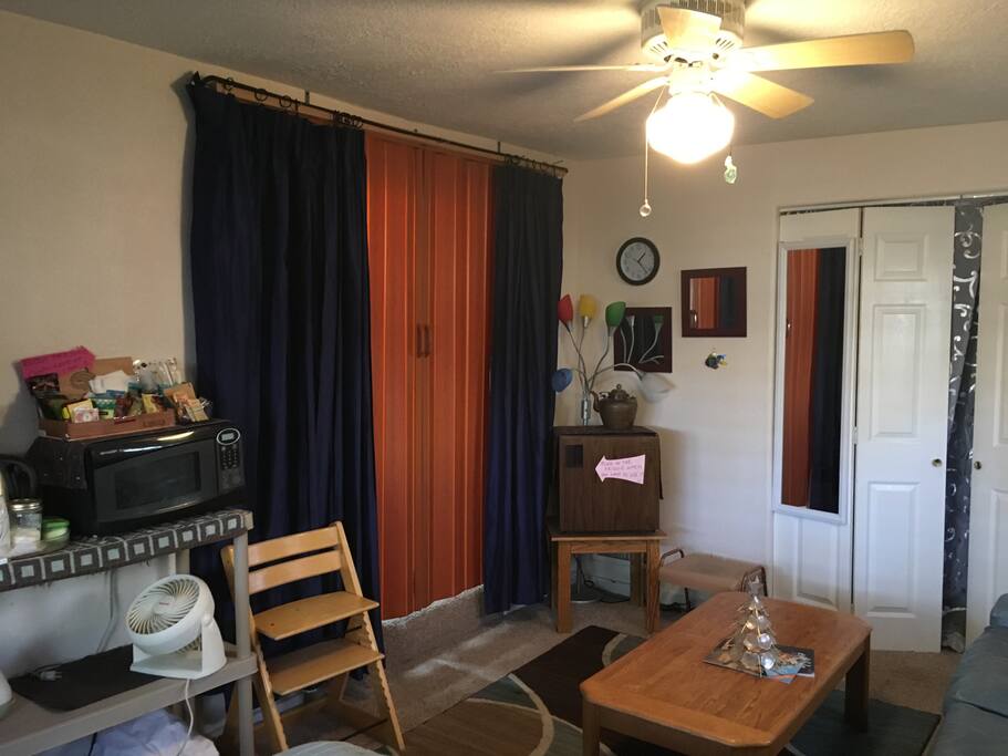 Accordion doors separate the room from the common area.