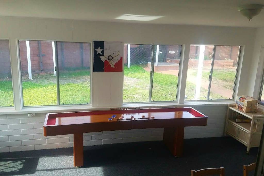 Shuffleboard in the sunroom.