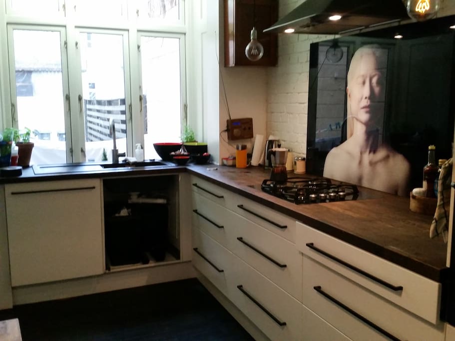 Kitchen with small table that sits five people