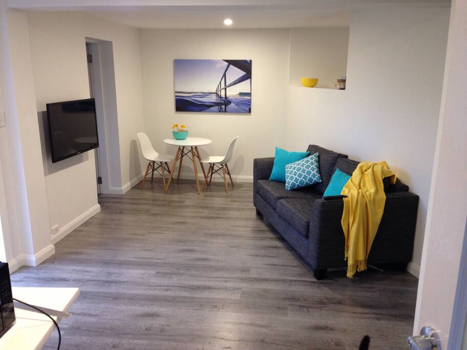 Comfortable airy living area with all brand new furniture. LCD TV with built in hard drive record, and DVD player, and USB input (great to look through your photos from the day)