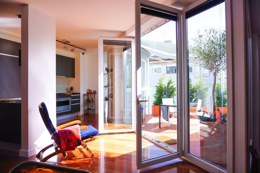 Spacious and comfortable living room, opening to the sunny terrace.