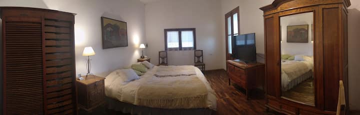 Bedroom 1 with en-suite bathroom.
The photo is panoramic.