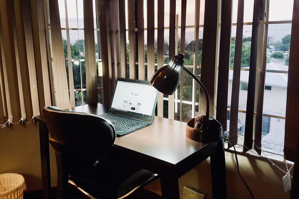 Writer’s desk with ergonomic chair and desk lamp.