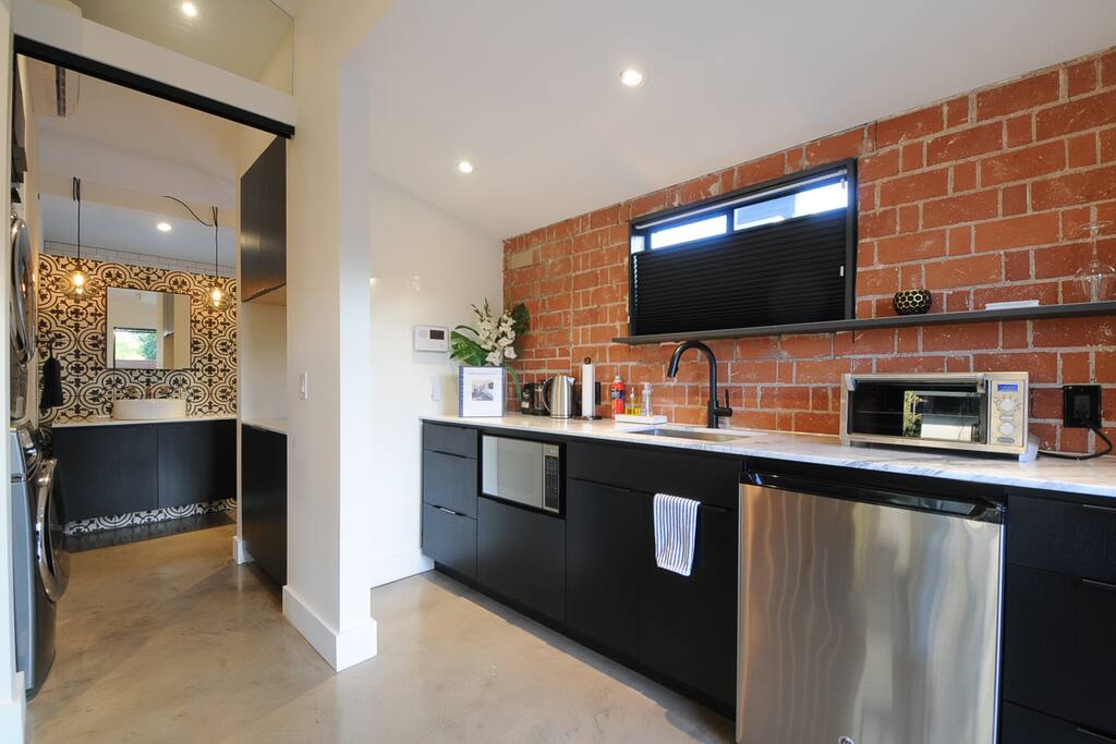Kitchenette includes microwave, mini-fridge, toaster over and French press coffee maker