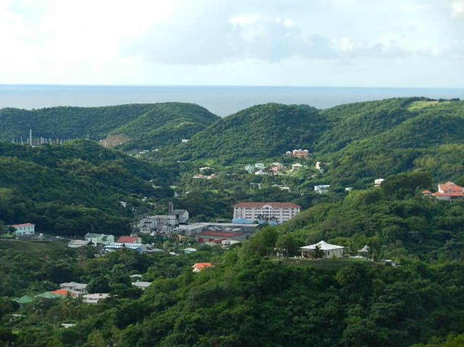 Lovely view of the valley below, rolling hills and ocean in the distance, from the apartment