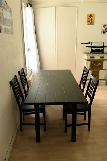 A total of six chairs and a big table are available for your meals.