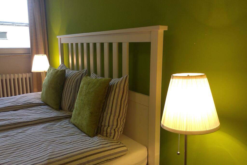 Queen-sized bed with the reading lamps