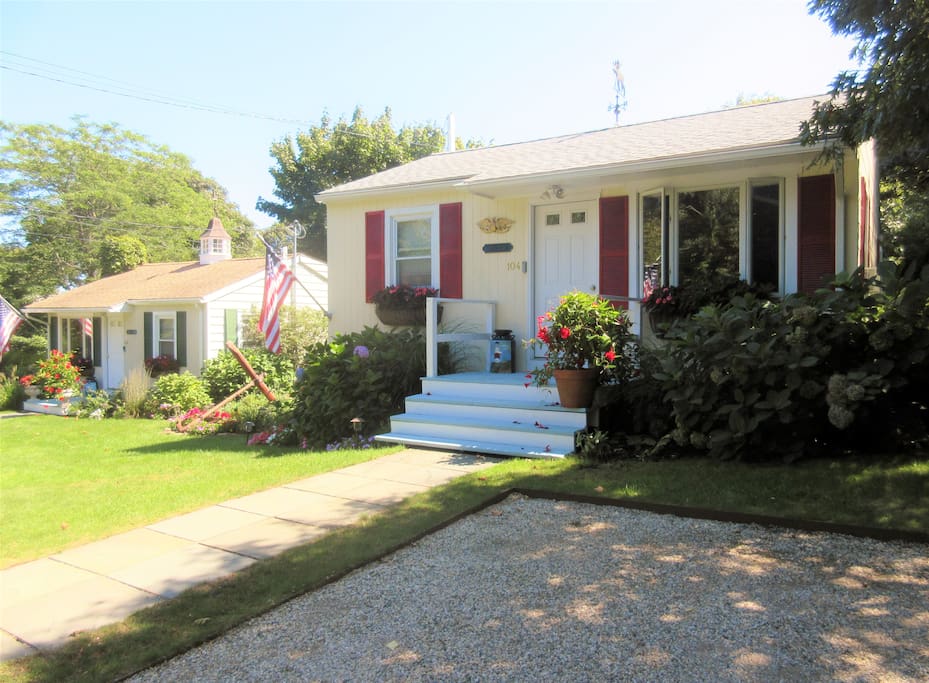 We have 2 cottages. The cottage with the red shutters is cottage 104 Adams - in this Listing.