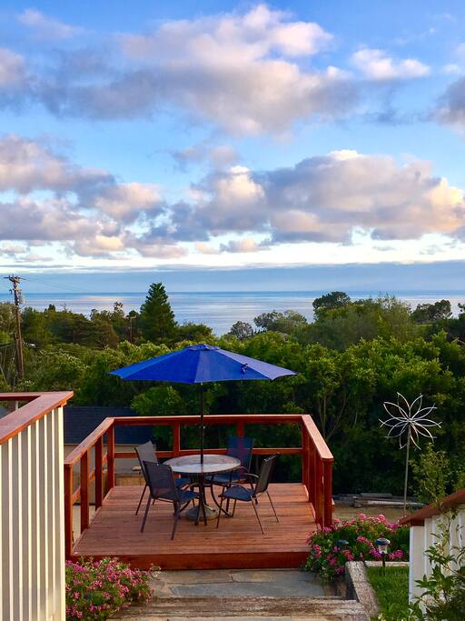 View from the front door and new deck for extra seating in the garden.