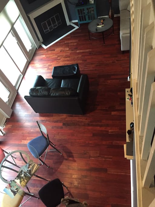 Living room with attached dining room set (view from loft). Attached balcony.