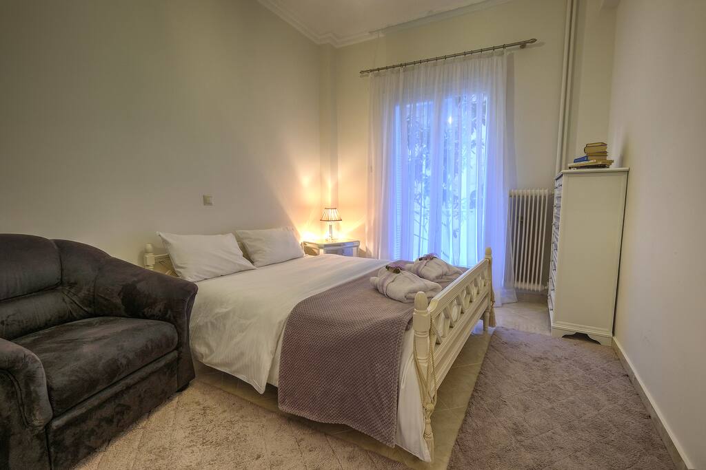 Master Bedroom: Bed and couch.