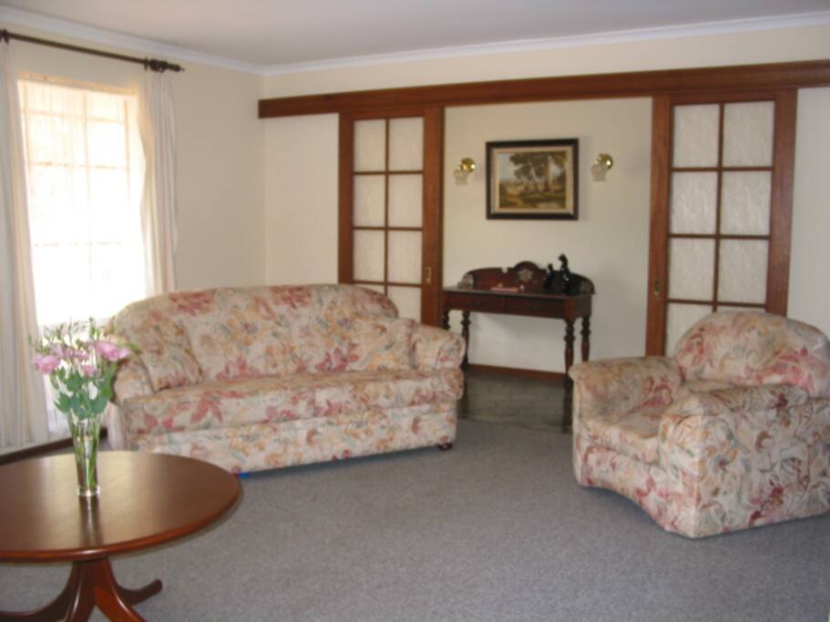 Lounge room with double sofa bed, Bar (inc bar fridge) Gas log fire & 42" LCD TV, DVD (also shows Entrance Hall)