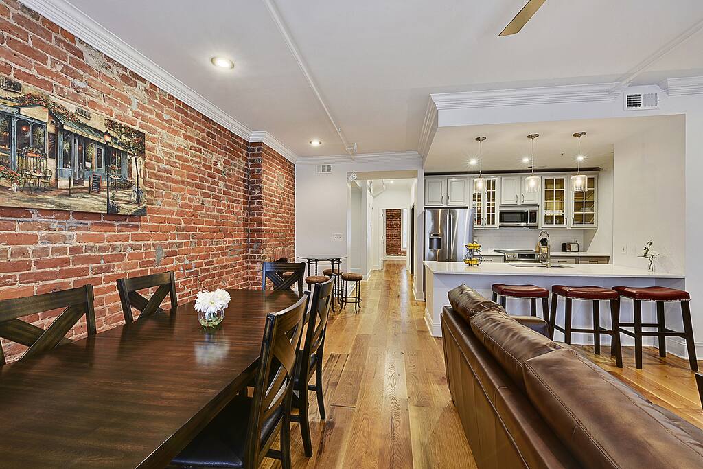 Enjoy the charm of the exposed brick walls, large open space of the living room, kitchen and dining room.