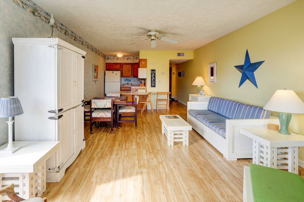 The coastal themed open living area is bright and inviting.
