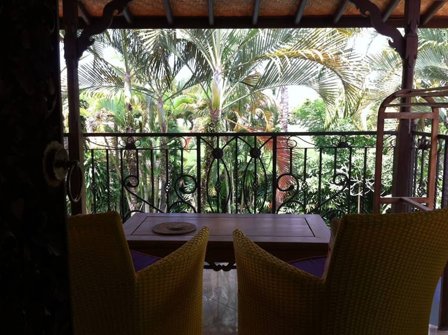 Upstairs balcony overlooking beautiful gardens and pool area.