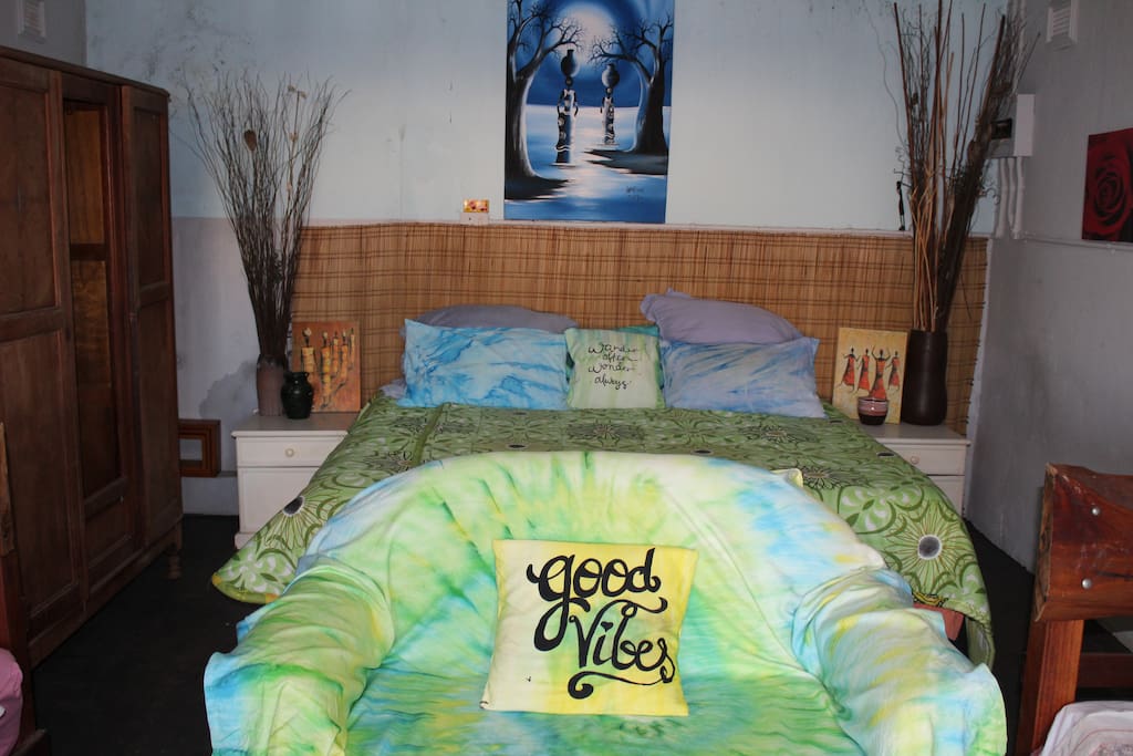 A separate double room located in a more private area with a shared bathroom close by.