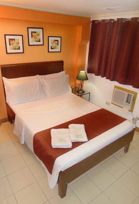 This is the Bedroom. It has a Queen Size bed and a private bathroom.