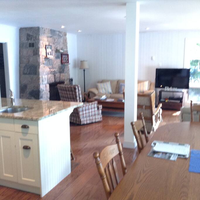 Newly renovated open concept living room, dining room, kitchen.