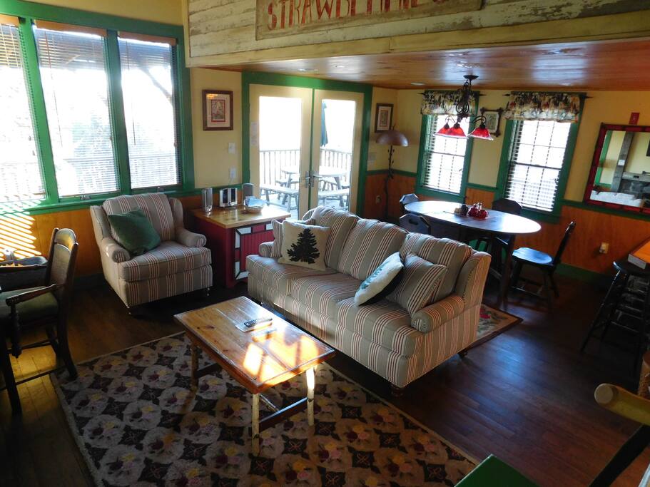 Living room and dining room. Gas fireplace & desk.