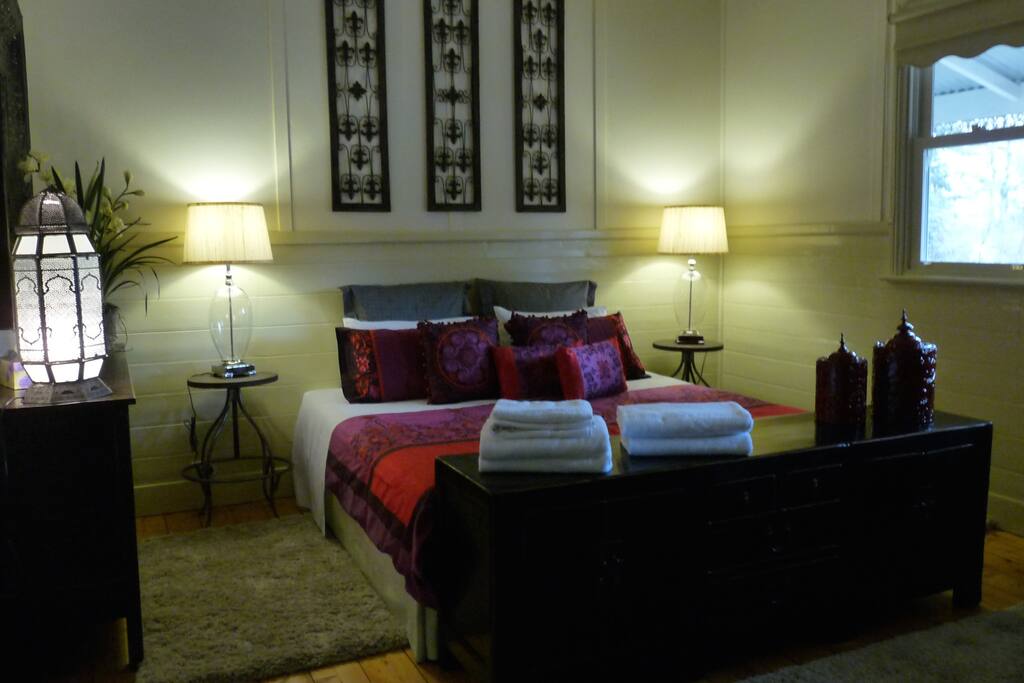 King bedroom with french doors opening to the verandah.