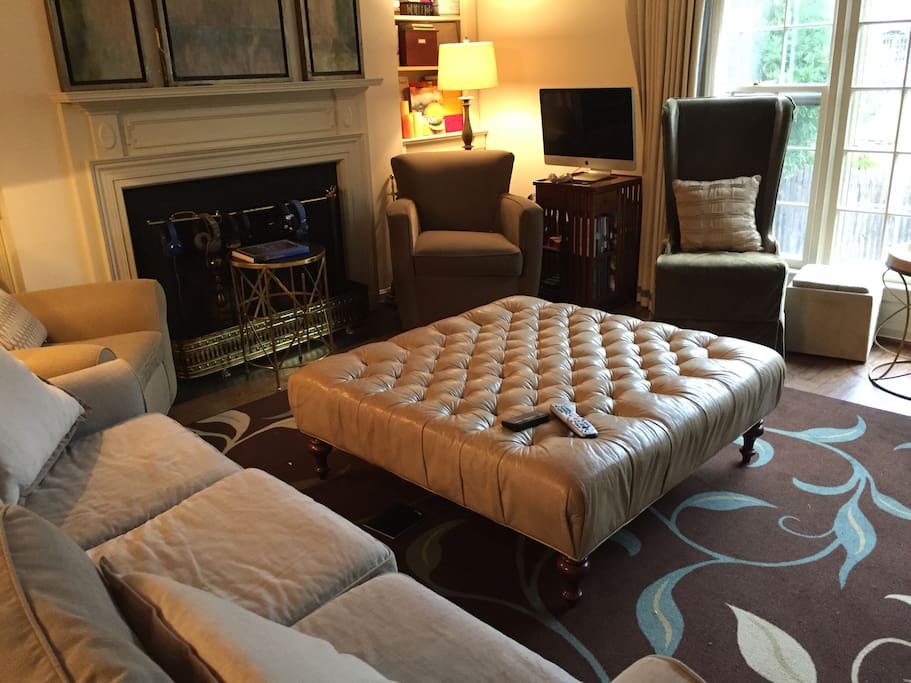 Living room with fireplace, large screen t-v & gaming console