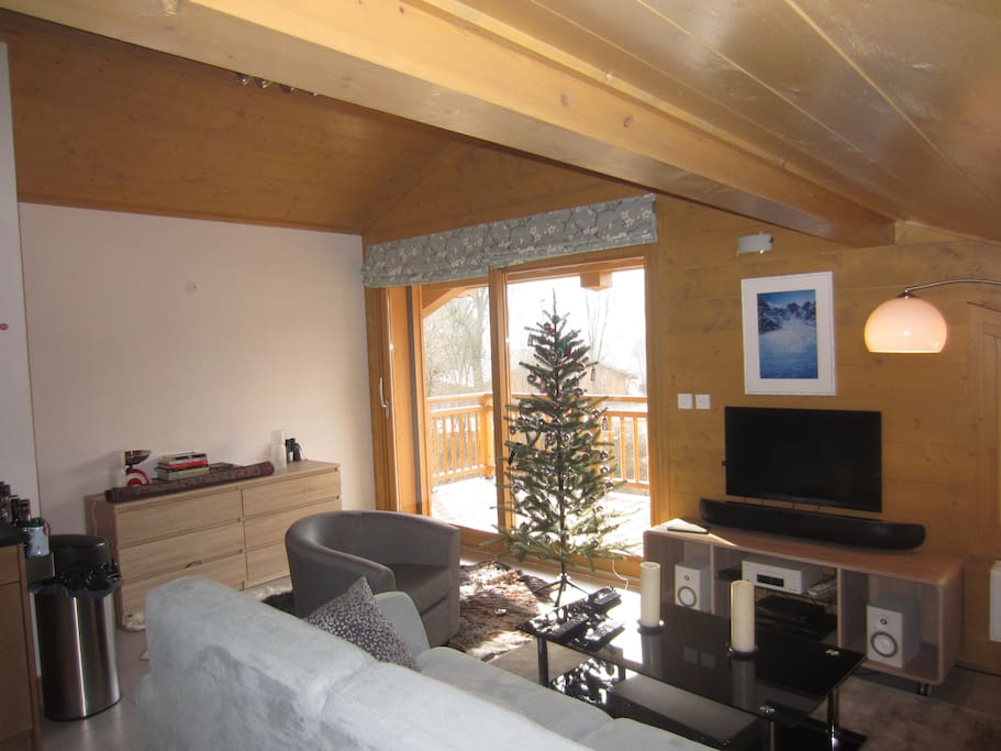 Sitting area has a three seater sofa, a two seater, and one easy chair - leads onto large balcony