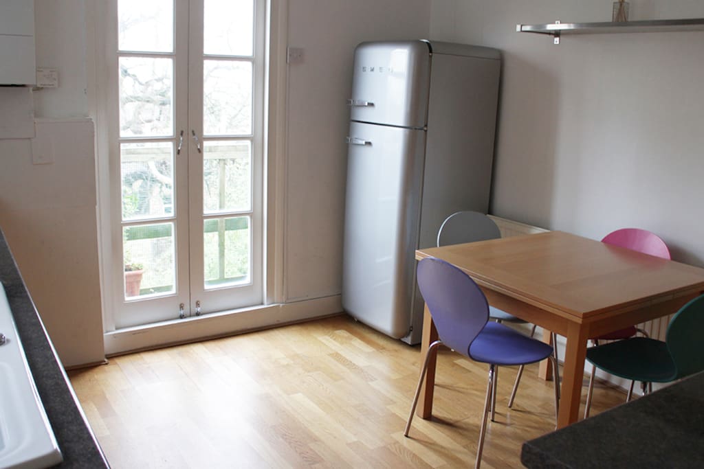 Kitchen with small balcony overlooking the garden