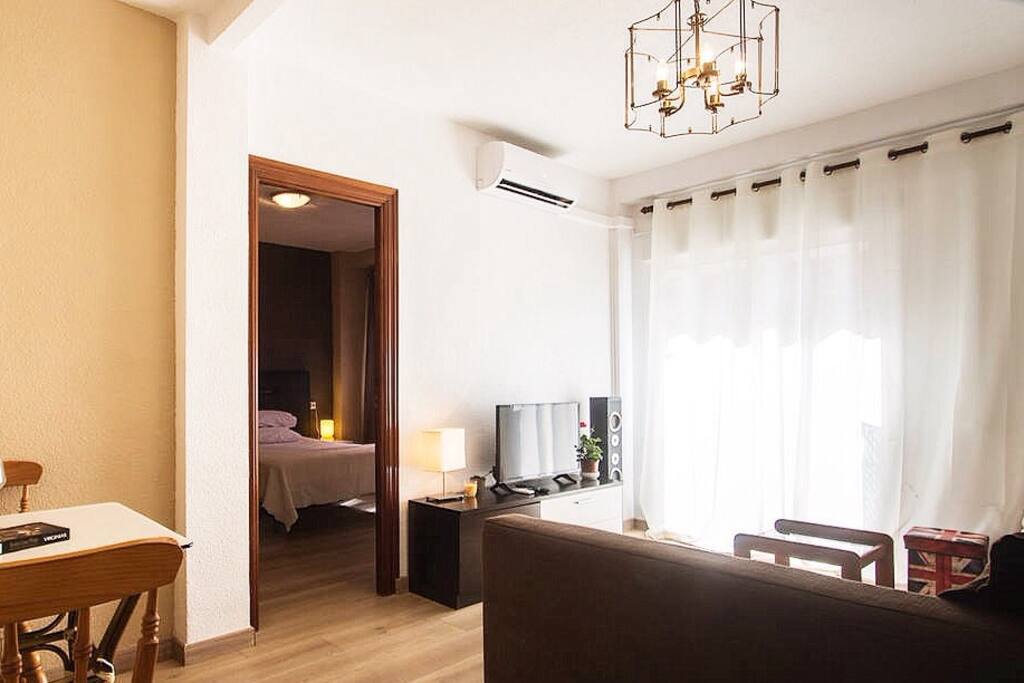 Living room with air conditioning and great comfortable sofa.