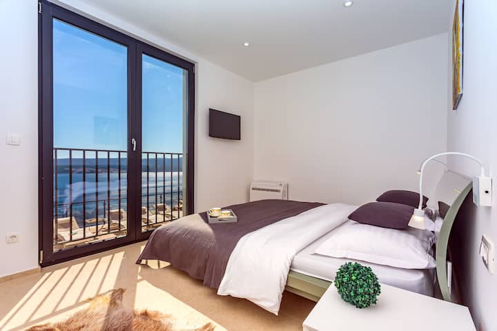 Bedroom No1 with King size bed 180x200cm with opened sea and pool views.