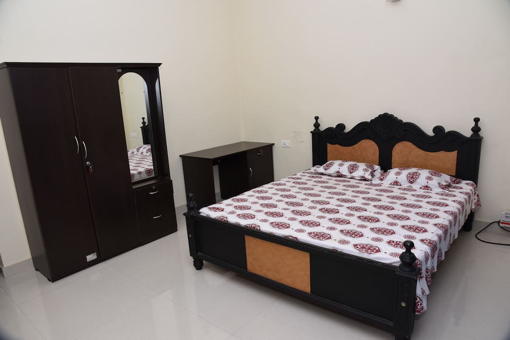 Master Bedroom
King size Bed having Wardrobe with mirror and writing Table furnished with Air-Conditioner