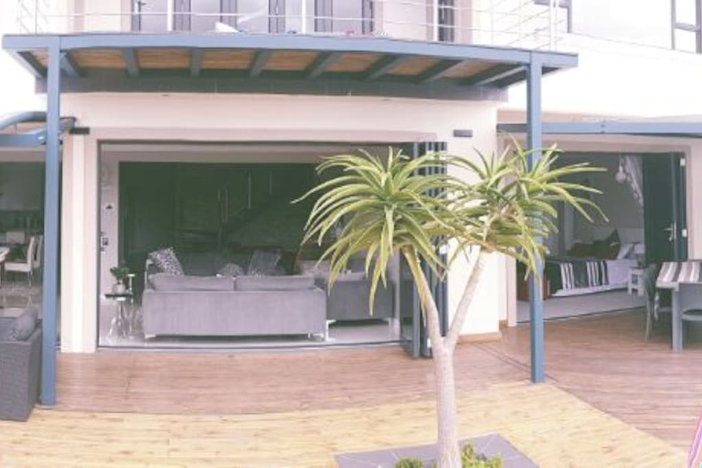 Front view of stackaway doors leading from house onto deck