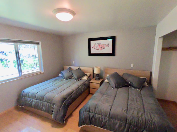 Bedroom with two full beds.