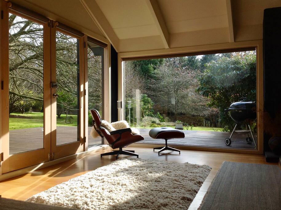 Original Eames Chair with views of the garden in winter