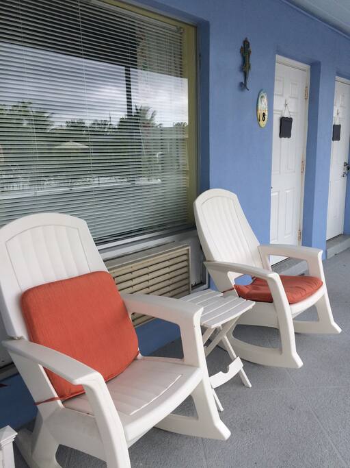 Two very comfortable rocking chairs along with a table located just outside your door!!