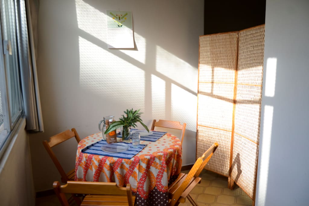 The dining area and the screen to close off the bedroom.