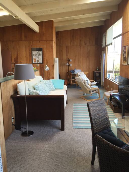 Long room takes advantage of the view - game table, TV, dining set