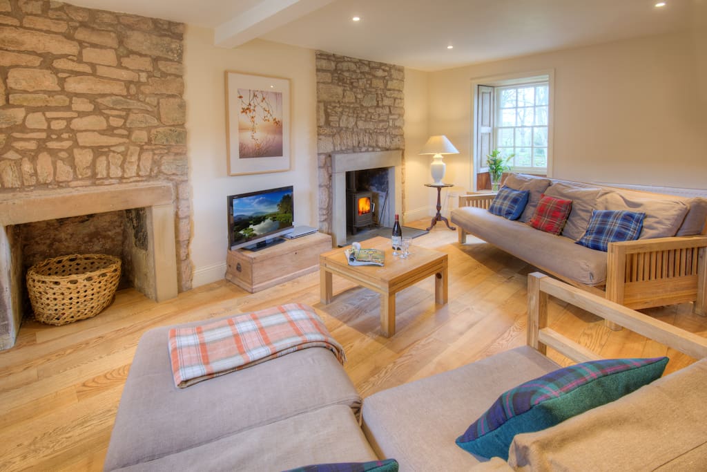 The sitting room at Keepers Cottage, with log-burning stove